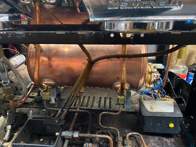 Copper boiler inside a commercial espresso machine during service